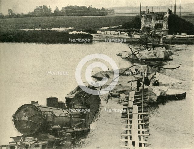 Bombed bridge and derailed train, northern France, First World War, 1914, (c1920). Creator: Unknown.