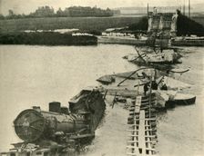 Bombed bridge and derailed train, northern France, First World War, 1914, (c1920). Creator: Unknown