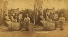 Boo-Peep. [Group of men and women seated outside, child peeking out of a barrel...], (1868-1900?). Creator: O. Pierre Havens