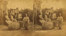 Boo-Peep. [Group of men and women seated outside, child peeking out of a barrel...], (1868-1900?). Creator: O. Pierre Havens