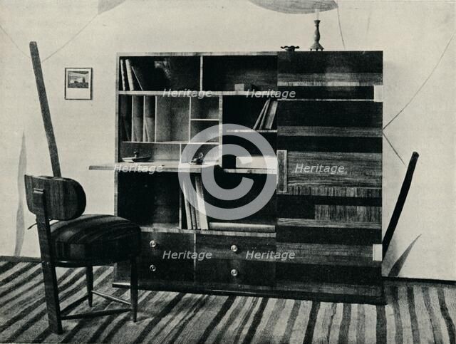 'Bookcase and Chair. Designed and executed by Hans Hartl', c1927. Artist: Unknown.
