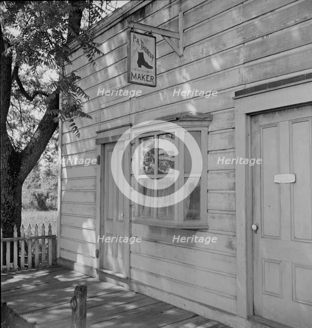 Boot and shoemaker shop in small California town, 1938. Creator: Dorothea Lange.