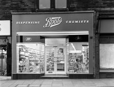 Boots the Chemist, Mexborough, South Yorkshire, 1965. Creator: Michael Walters