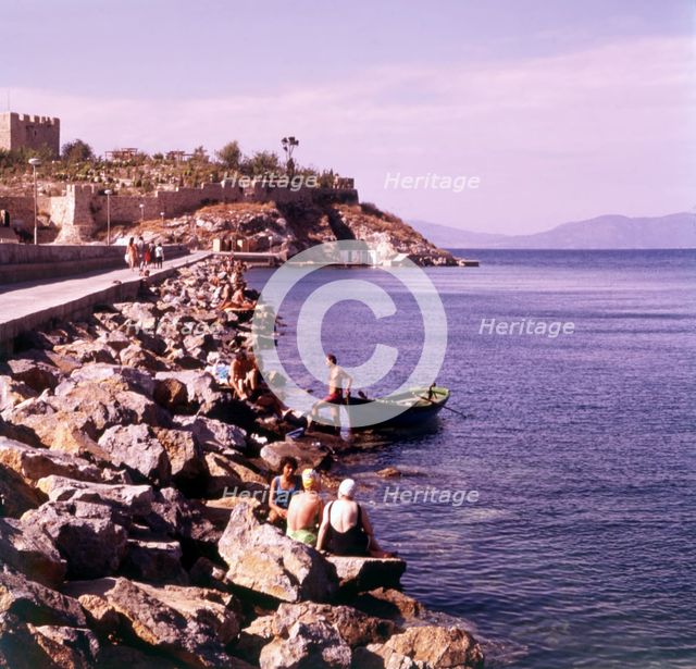 Bathing from the causeway, Kusadasi, Turkey, c1955. Creator: Arthur Charles Kirby Ware.