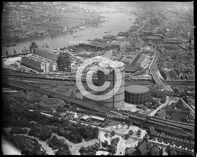 Battersea Power Station under construction and the Gas Holder Station, Nine Elms, London, c1930s. Creator: Arthur William Hobart.
