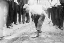 Bayonne picking up stones, between c1910 and c1915. Creator: Bain News Service