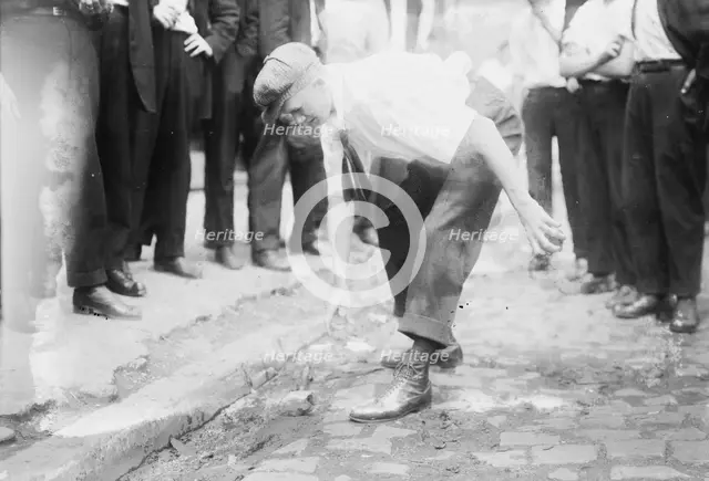 Bayonne picking up stones, between c1910 and c1915. Creator: Bain News Service.