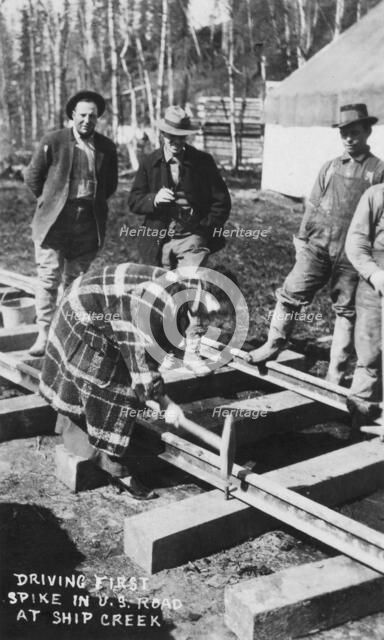 Babe White driving first spike in U.S. Railroad, between c1900 and c1930. Creator: Unknown.