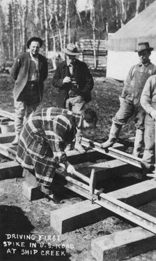Babe White driving first spike in U.S. Railroad, between c1900 and c1930. Creator: Unknown
