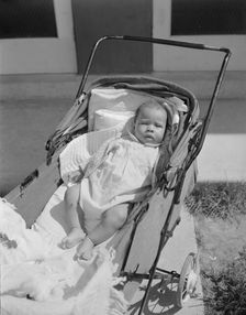 Baby taking a sun bath, Frederick Douglass housing project, Anacostia, D.C., 1942. Creator: Gordon Parks
