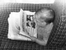 Baby Alex Feldman "reading" the "Jewish Chronicle", 1968. Creator: Unknown