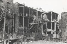 Back steps of apartments in Negro section of Chicago, Illinois, April 1941. Creators: Farm Security Administration, Russell Lee