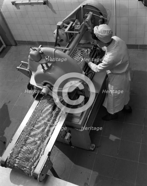 Bacon slicing machine, Danish Bacon Company, Selby, North Yorkshire, 1964. Artist: Michael Walters