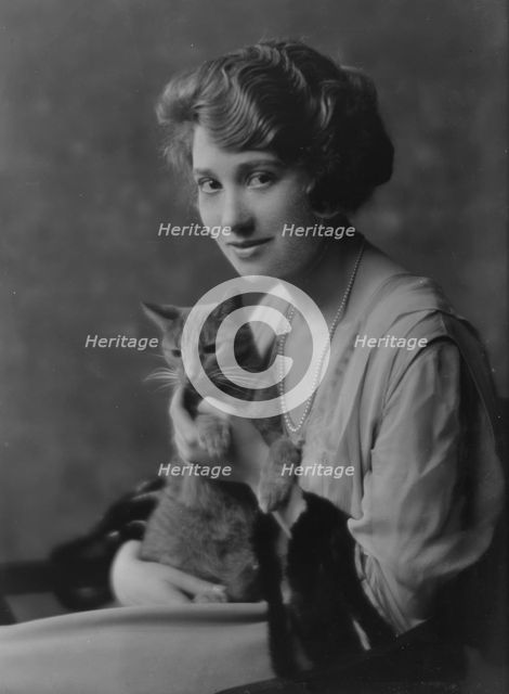 Bainter, Fay, Miss, with Buzzer the cat, portrait photograph, 1916. Creator: Arnold Genthe.