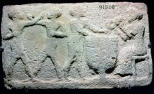 Baked clay plaque of two boxers fighting, while musicians play, from Larsa, Iraq, 2000BC-1750BC