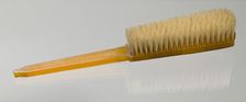 Bakelite clothes brush from dresser set owned by Lena Horne, mid 20th Century. Creator: Agalin