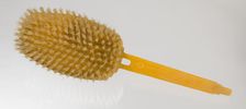 Bakelite hair brush from dresser set owned by Lena Horne, mid 20th Century. Creator: Agalin