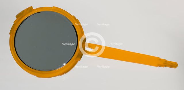 Bakelite hand mirror from dresser set owned by Lena Horne, mid 20th Century. Creator: Agalin.