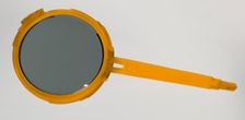 Bakelite hand mirror from dresser set owned by Lena Horne, mid 20th Century. Creator: Agalin