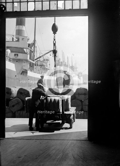 Bales being prepared for loading in London docks, c1945-c1965. Artist: SW Rawlings