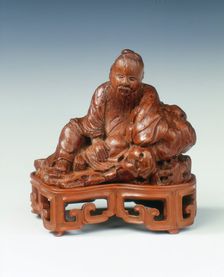 Bamboo carving of a scholar leaning against a rock, China, c1662-c1722. Creator: Unknown