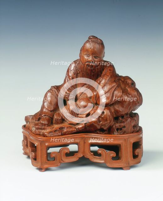 Bamboo carving of a scholar leaning against a rock, China, c1662-c1722. Creator: Unknown.