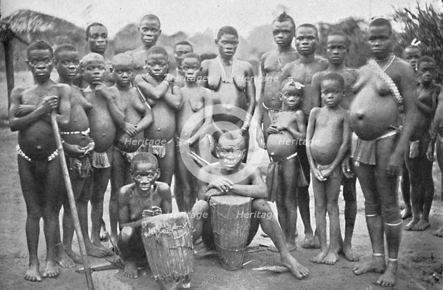 Bambute Pygmy group with two Walese women, 1902. Artist: Unknown.