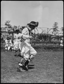 Bampton Morris troupe performing in a Pipe Dance Bampton, West Oxfordshire, Oxfordshire, 1920-30. Creator: George R Long
