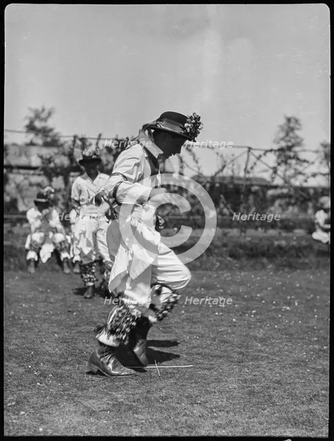 Bampton Morris troupe performing in a 'Pipe Dance', Bampton, West Oxfordshire, Oxfordshire, 1920-30. Creator: George R Long.