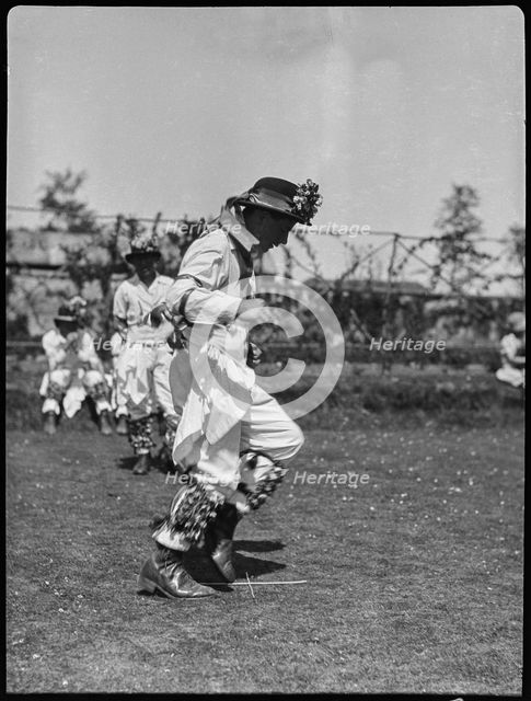 Bampton Morris troupe performing in a 'Pipe Dance', Bampton, West Oxfordshire, Oxfordshire, 1920-30. Creator: George R Long.