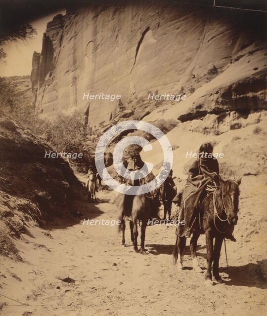 Band of mounted Navahos passing through Cañon, c1904. Creator: Edward Sheriff Curtis.