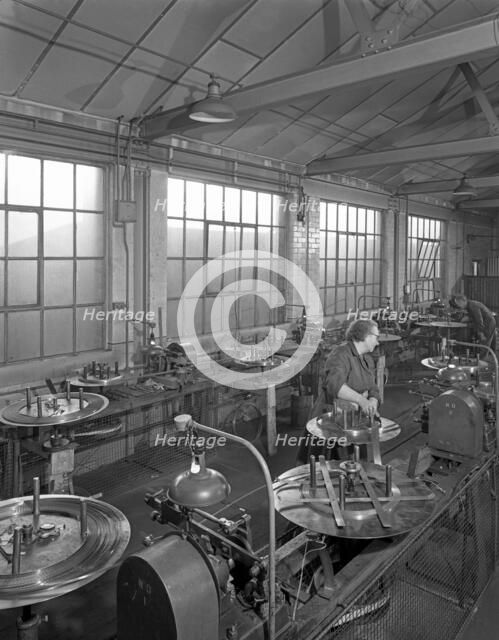 Bandsaw sharpening at Slack Sellars & Co, Sheffield, South Yorkshire, 1963. Artist: Michael Walters