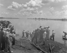 Baptism by immersion in the MIssissippi River, May 29, 1938: ankle-deep in water. Creator: Frances Benjamin Johnston