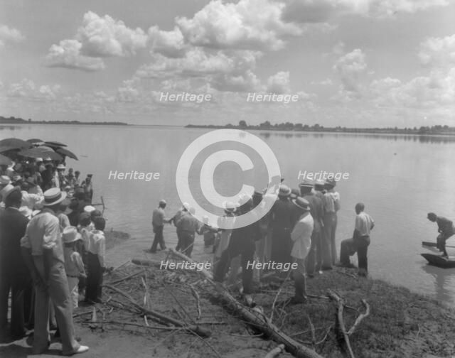 Baptism by immersion in the MIssissippi River, May 29, 1938: ankle-deep in water. Creator: Frances Benjamin Johnston.