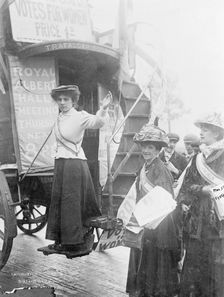 Barbara Ayrton on the bottom stair of the Votes for Women bus, October 1909. Creator: Unknown