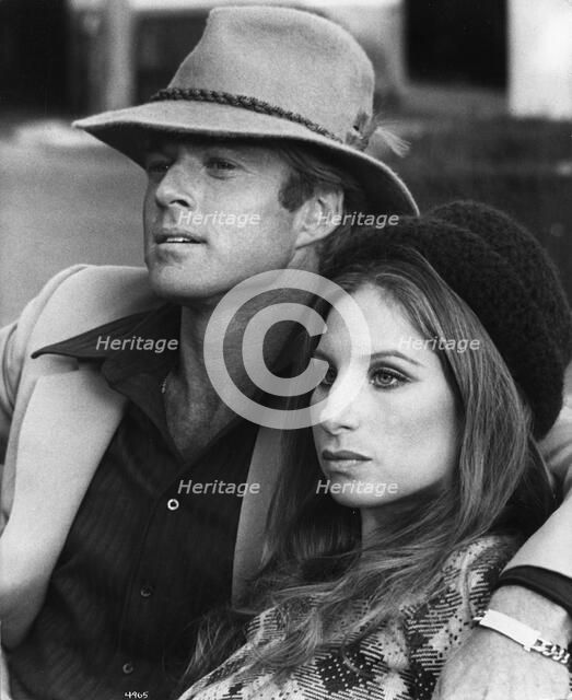Barbara Streisand (1942-), American singer and actress with Robert Redford (1937-), 1973. Artist: Unknown