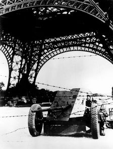 Barbed wire and anti-tank gun beneath the Eiffel Tower, German-occupied Paris, 1940-1944