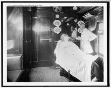 Barber shop on a deluxe overland limited train, between 1910 and 1920. Creator: Unknown