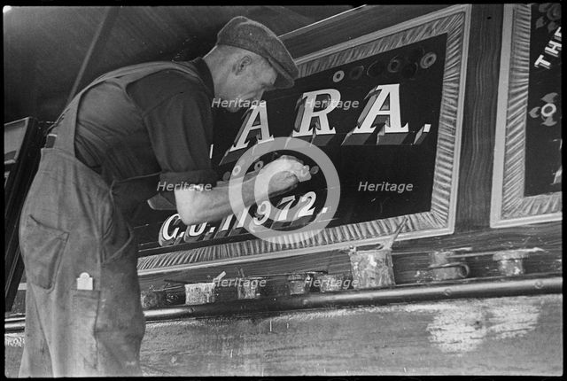Barge painter Frank Jones, of 3 Edward Street, at work, Leighton Buzzard, Bedfordshire, 1910-60. Creator: George R Long.