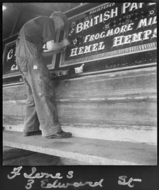 Barge painter Frank Jones, of 3 Edward Street, at work, Leighton Buzzard, Bedfordshire, 1910-60. Creator: George R Long