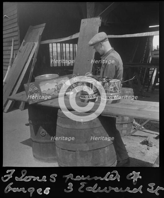 Barge painter Frank Jones, of 3 Edward Street, at work, Leighton Buzzard, Bedfordshire, 1910-60. Creator: George R Long.