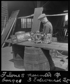 Barge painter Frank Jones, of 3 Edward Street, at work, Leighton Buzzard, Bedfordshire, 1910-60. Creator: George R Long