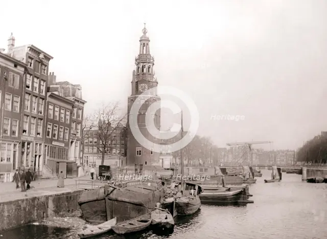 Barges on the canal in front of the Montelbaanstoren, Amsterdam, 1898.Artist: James Batkin