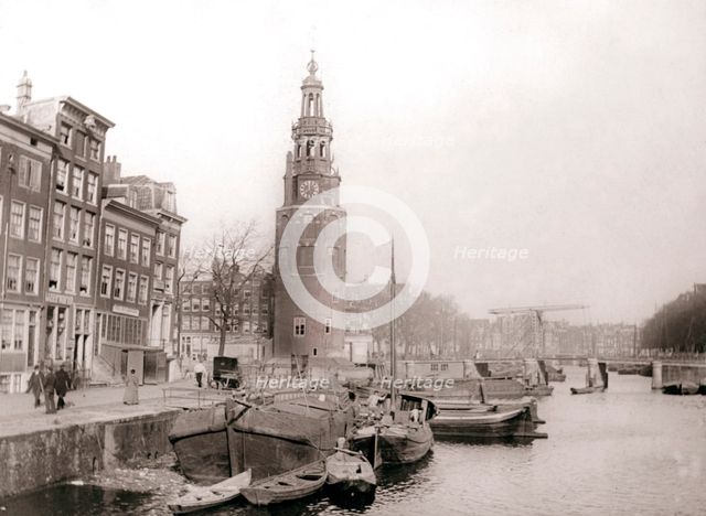 Barges on the canal in front of the Montelbaanstoren, Amsterdam, 1898.Artist: James Batkin