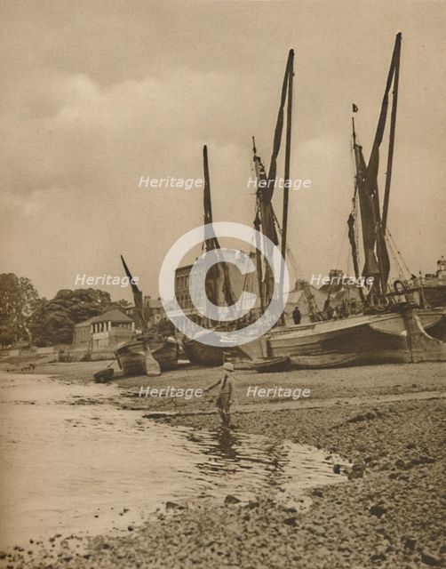 'Barges Aground At Mortlake With The Tide at Full Ebb', c1935. Creator: Donald McLeish.