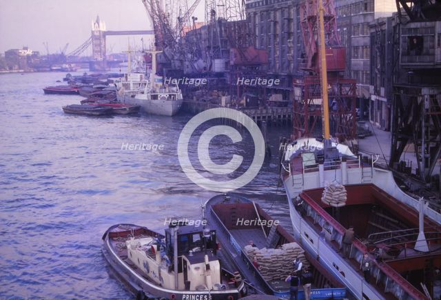 Barges in the Pool of London. River Thames and Tower Bridge, London, 1962. Artist: CM Dixon.
