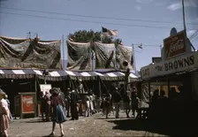 Barker at the grounds of the Vermont state fair, Rutland, 1941. Creator: Jack Delano
