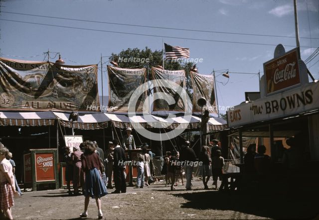 Barker at the grounds of the Vermont state fair, Rutland, 1941. Creator: Jack Delano.