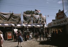 Barker at the grounds of the Vermont state fair, Rutland, 1941. Creator: Jack Delano