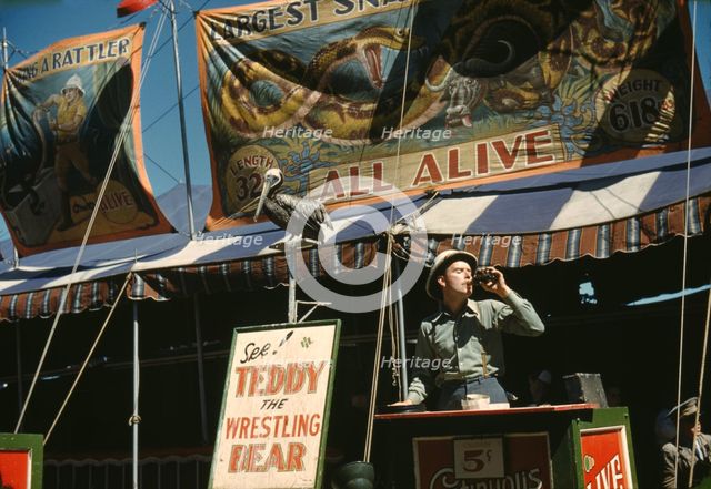Barker at the grounds at the Vermont state fair, Rutland, 1941. Creator: Jack Delano.
